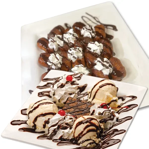 Two plates of chocolate desserts with ice cream, pastries, and cherries.