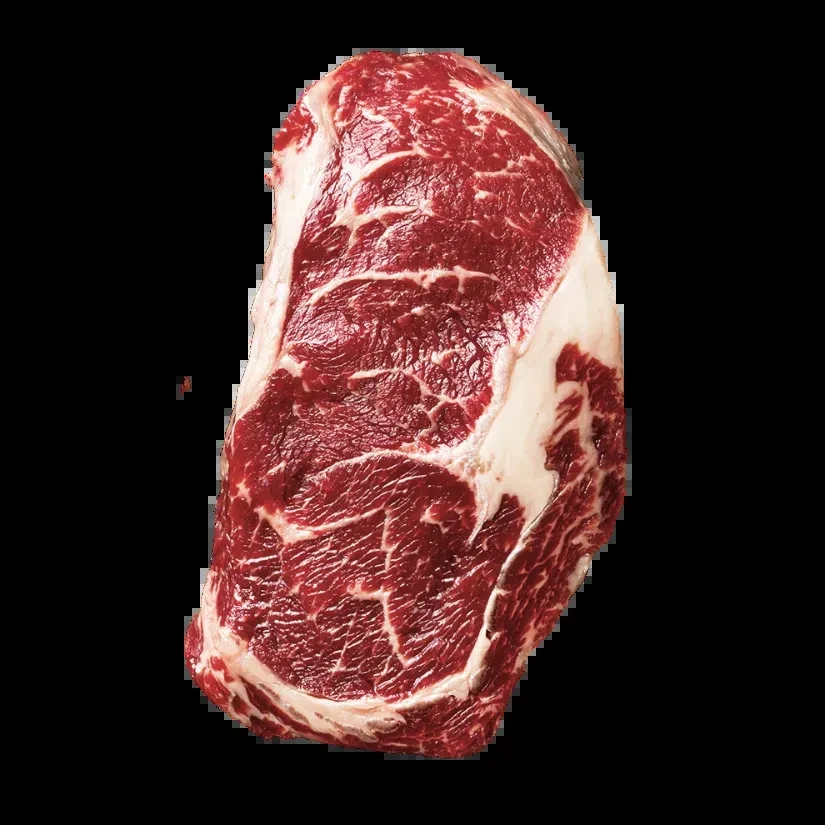 Raw, deep red beef steak with prominent white marbling on black.