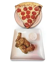 A slice of pepperoni pizza and four seasoned chicken wings with dip.