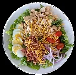 Overhead salad with chicken, cheese, tomatoes, eggs, bacon, red onion.