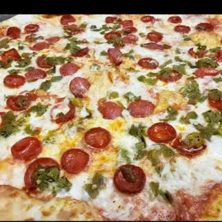 Freshly baked pepperoni pizza with melted cheese, golden crust, and green toppings.