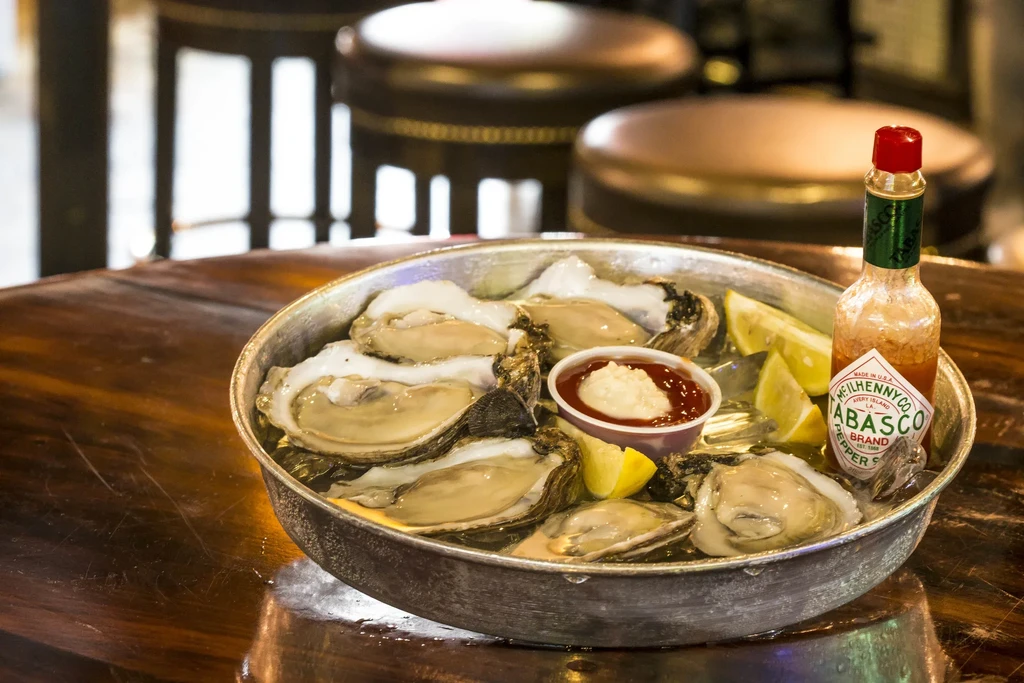 Fresh shucked oysters on ice with lemon, horseradish, Tabasco sauce.