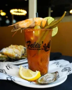 Felix's Fish Camp Bloody Mary with shrimp, okra, olives, and oyster.