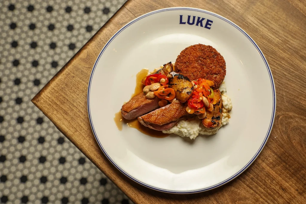 Seared duck breast, pineapple, chili, almonds, and golden croquette.