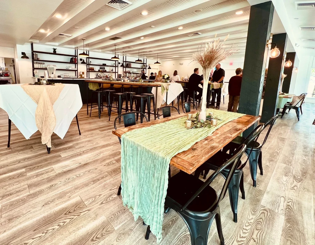 Interior view of a modern restaurant dining area and bar.