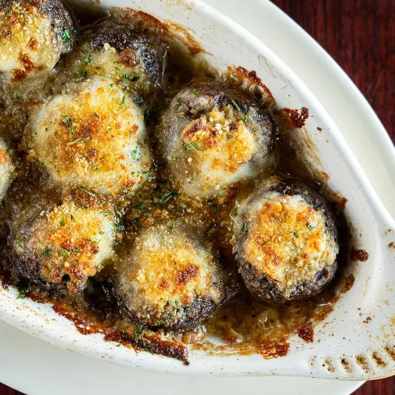 Savory baked stuffed mushrooms with golden crispy topping.
