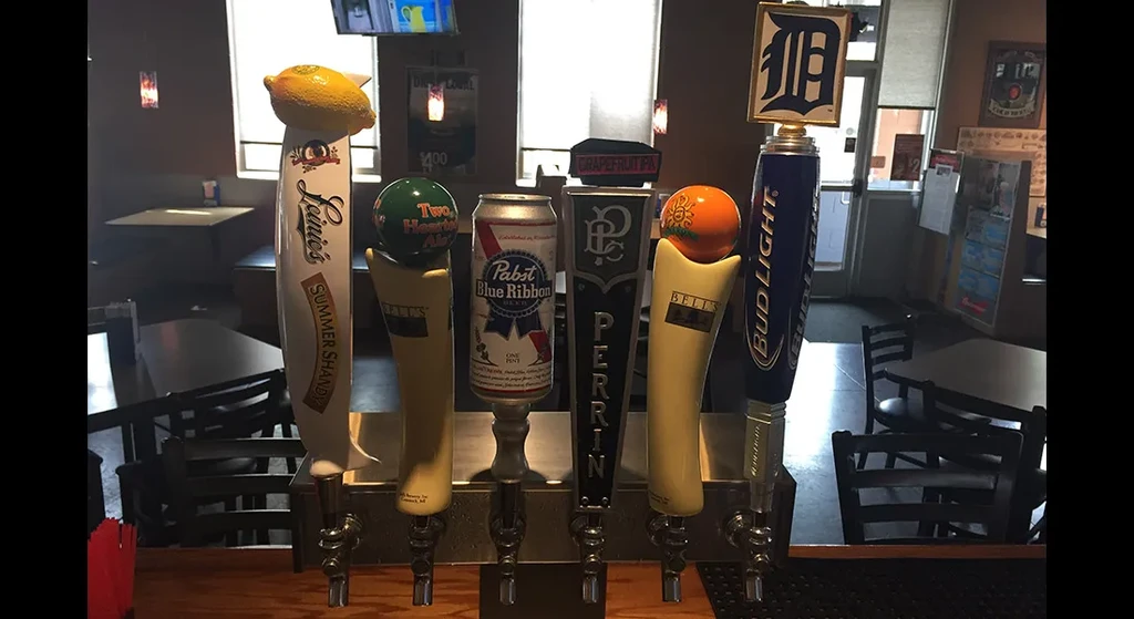 Five distinct beer taps, including a Pabst can and Tigers Bud Light.