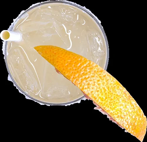 Overhead: Light drink with ice, orange peel garnish, and a textured rim.