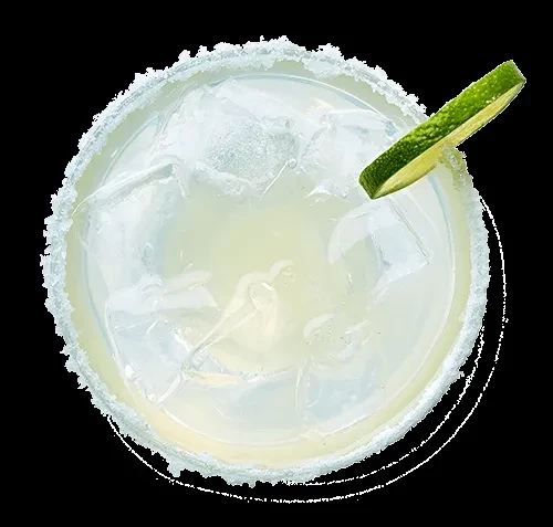 Top-down margarita with ice, salted rim, and lime wedge.