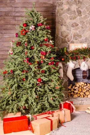Festive indoor scene with a decorated tree, fireplace, and gifts.