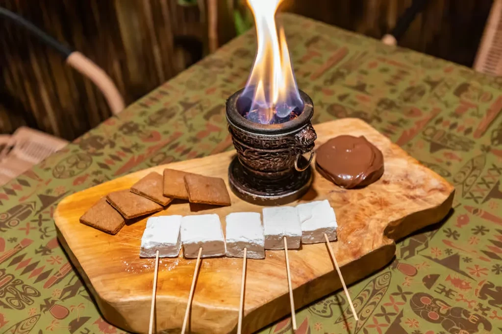 S'mores roasting kit with brazier, marshmallows, chocolate, graham crackers.