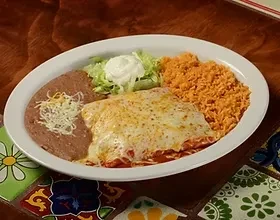 Cheese-covered dish, refried beans, rice, lettuce, and sour cream.