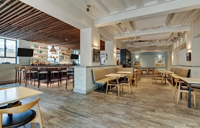 Well-lit, empty modern restaurant and bar with detailed decor.