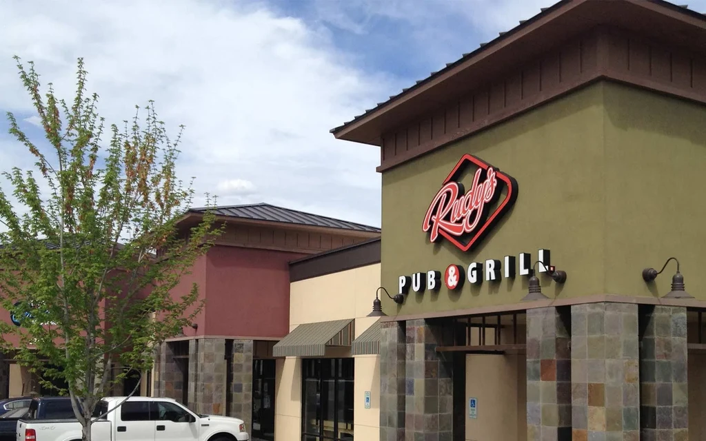 Facade of Rudy's Pub & Grill with prominent red and white sign.