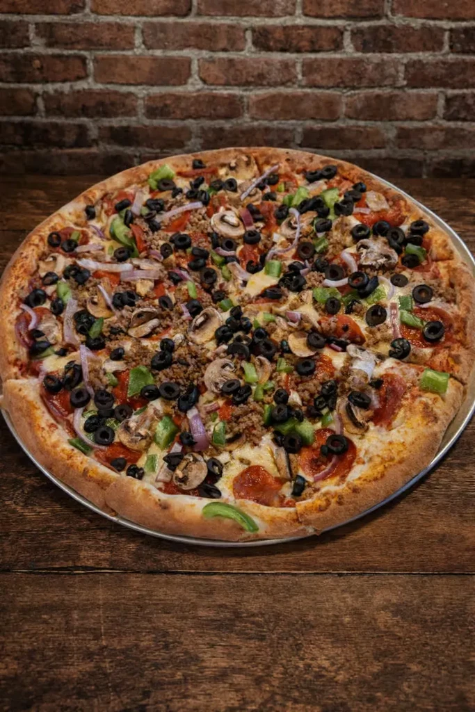 Large pizza loaded with pepperoni, sausage, olives, mushrooms, and peppers.