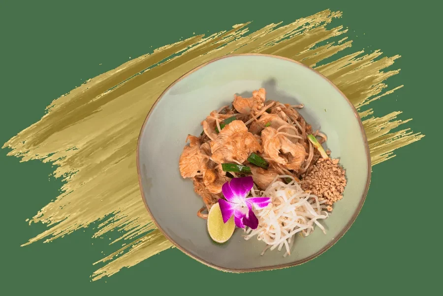 Top-down view of chicken noodles, lime, peanuts, and a purple orchid.