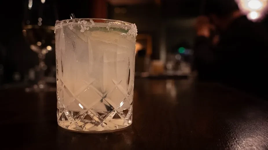 Frosty cocktail with a rim in a textured cut-glass.