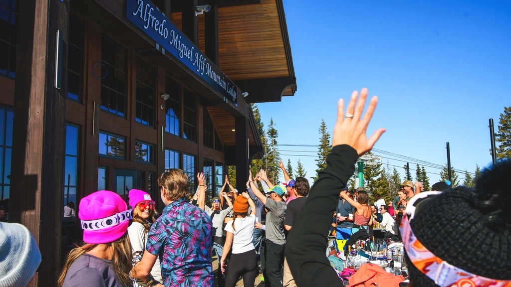 Vibrant crowd cheers outside Alfredo Miguel Afif Mountain Lodge.