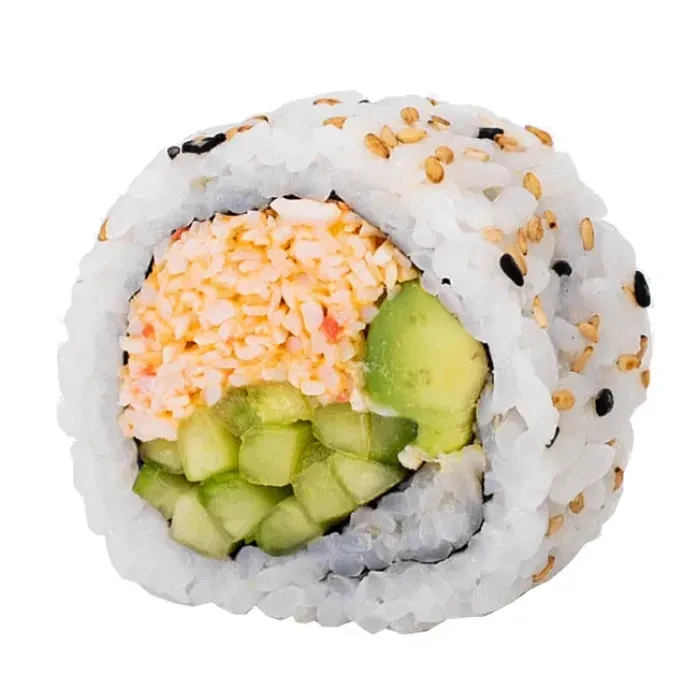 Cross-section of uramaki sushi with creamy filling, avocado, cucumber, and sesame.