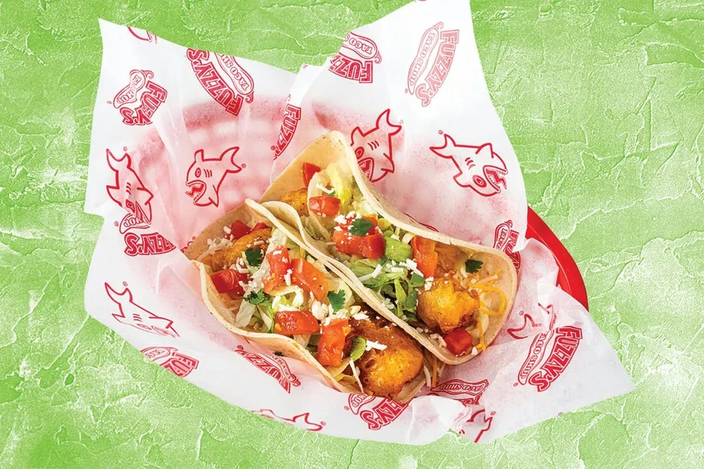 Two crispy fish tacos in Fuzzy's Taco Shop basket.
