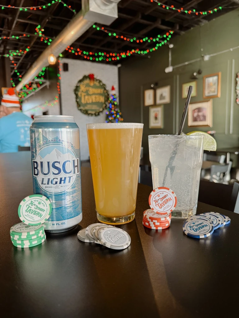 Holiday-decorated 36th Street Tavern with drinks and custom poker chips.