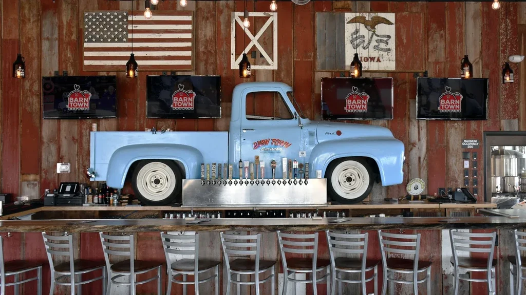 Barn Town Brewing's rustic bar features a vintage blue pickup truck.