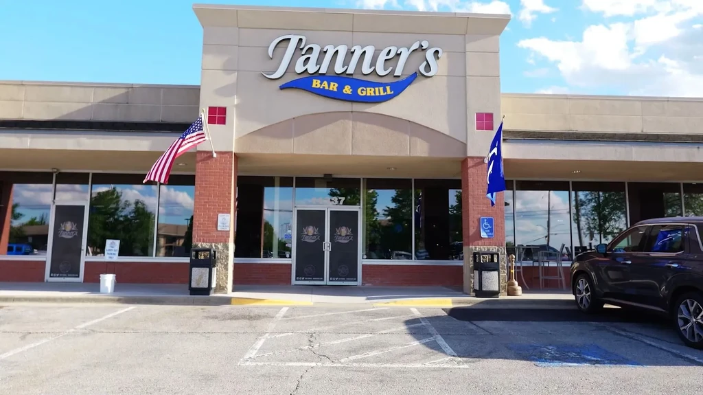 Exterior of Tanner's Bar & Grill building on a sunny day.