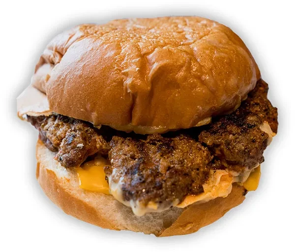 Close-up: Smashed double burger, brioche bun, melted cheese, creamy sauce.