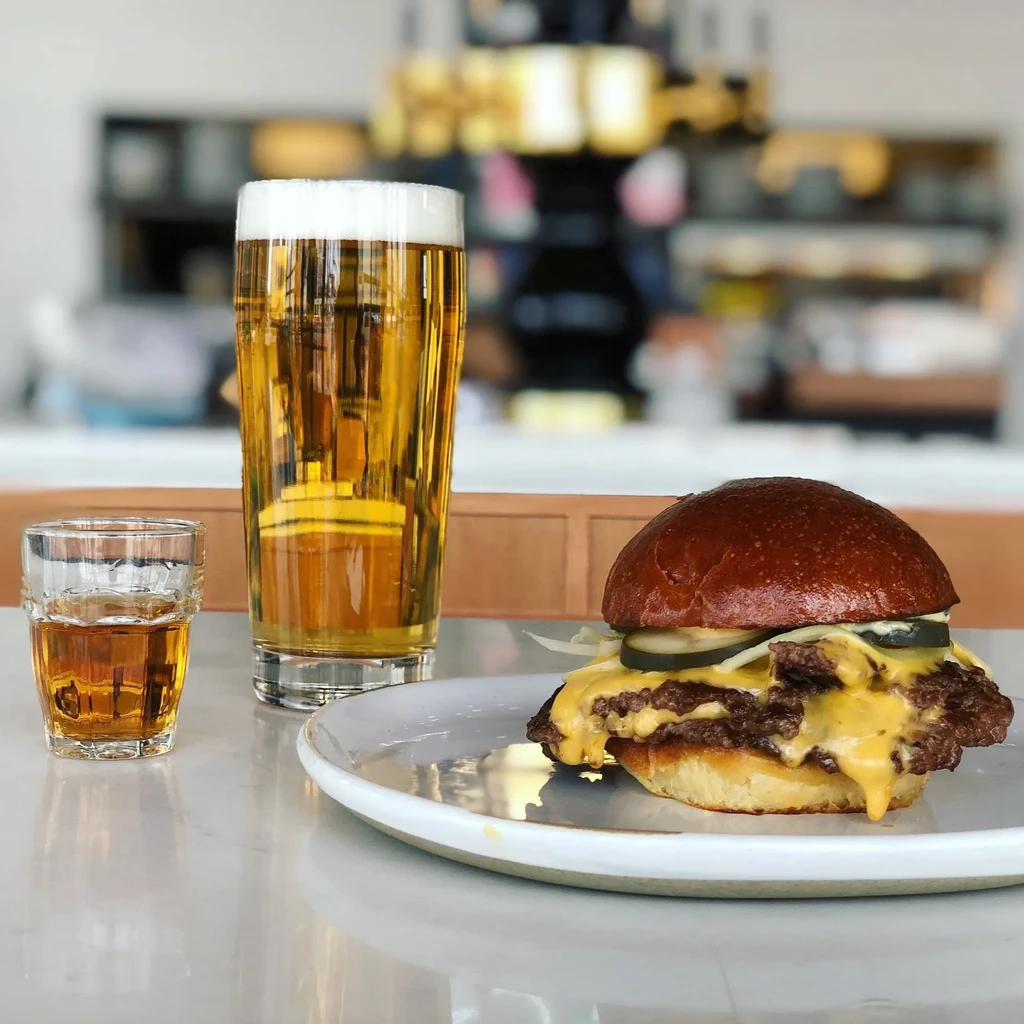 Double smash burger with cheese, beer, and spirit shot.
