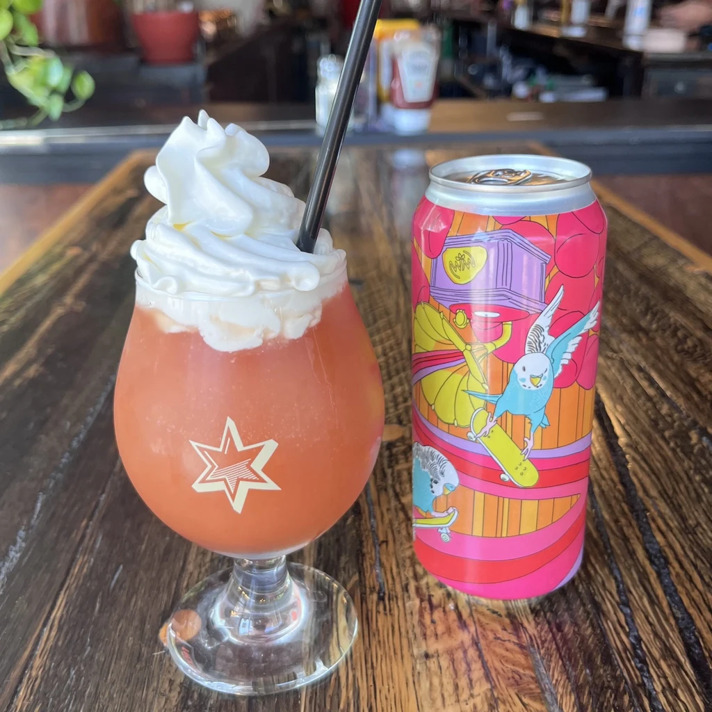 Whipped cream cocktail and aluminum can with skateboarding parakeets.