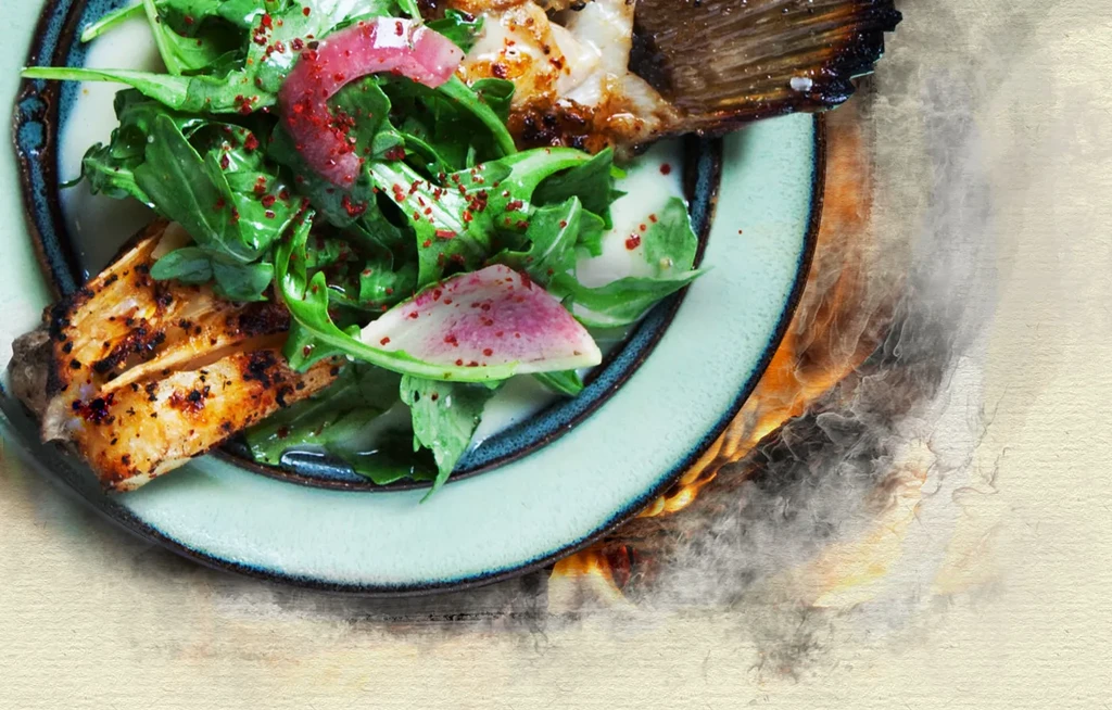 Grilled fish with crispy skin, arugula salad, and watermelon radishes.