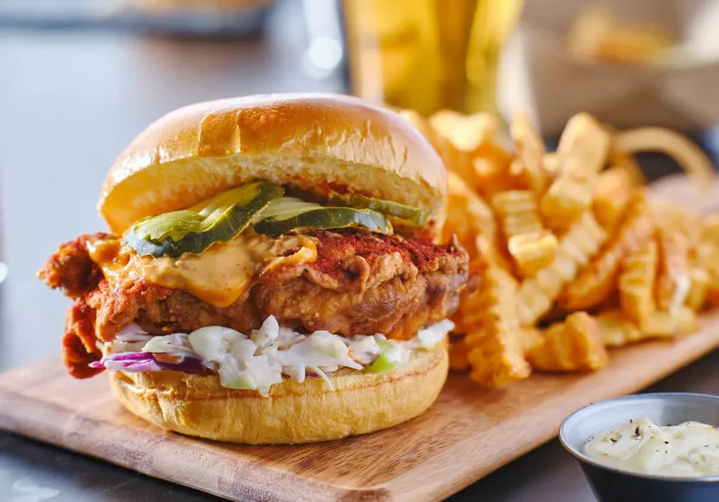 Fried chicken sandwich, pickles, coleslaw, crinkle fries, dipping sauce.