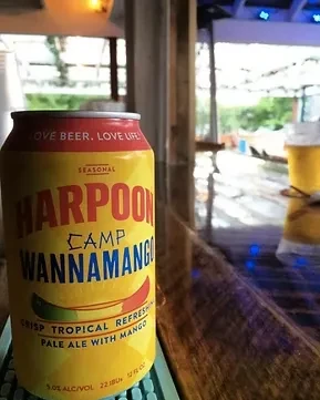 Harpoon Camp Wannamango mango pale ale can on a bar top.
