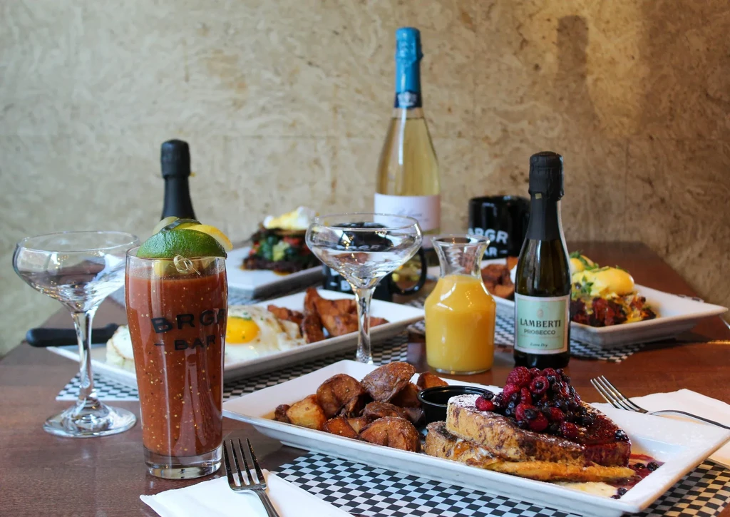 Brunch spread: Bloody Mary, French toast, eggs, and sparkling wine.