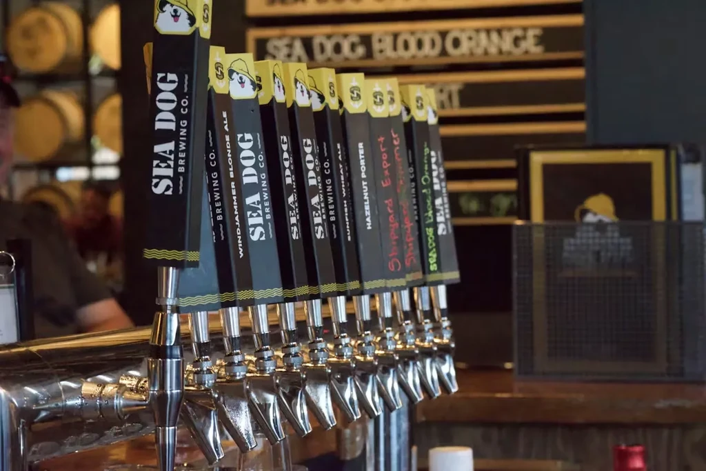 Sea Dog Brewing Co. black and yellow beer tap handles.