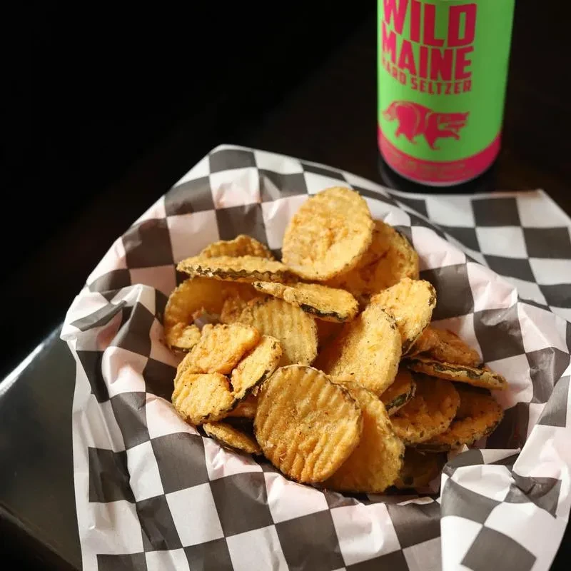 Basket of fried pickles and a Wild Maine Hard Seltzer can.