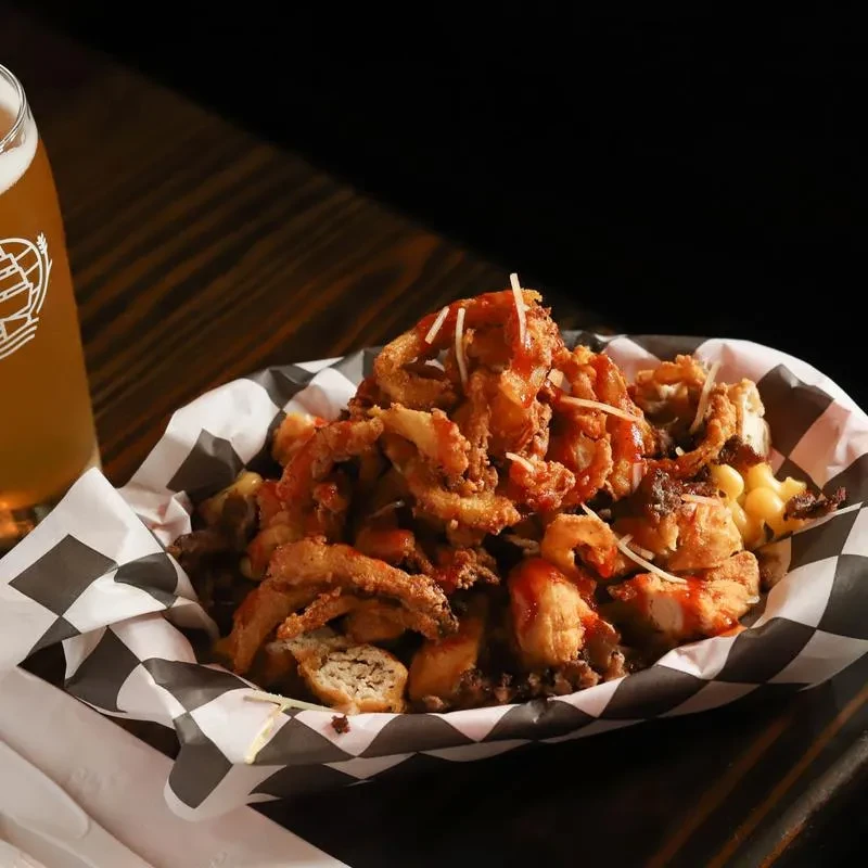 Fried food, macaroni, red sauce, shredded cheese, and beer.