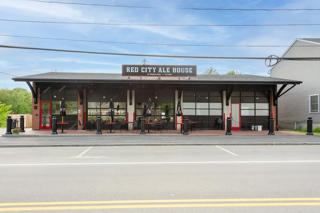 Modern industrial Red City Ale House with brick facade and outdoor patio.