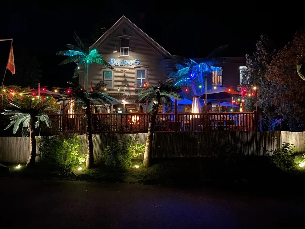 Pedro's restaurant at night, brightly lit tropical outdoor patio.