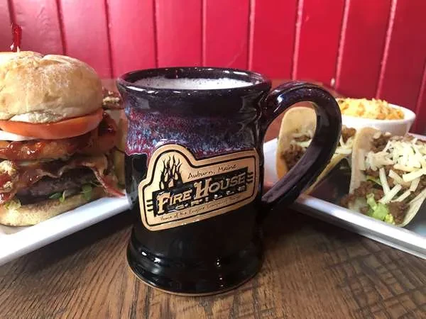 Auburn Fire House Grille mug, loaded burger, tacos, and macaroni.