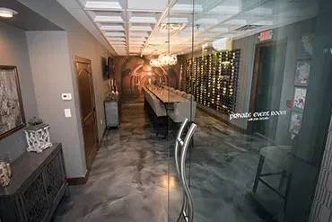 Sophisticated private dining area with tunnel mural and event room.