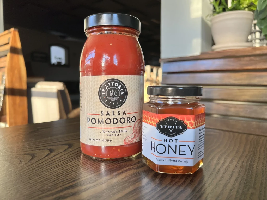 Two jars: Trattoria Delia Salsa Pomodoro and Pizzeria Verità Hot Honey.