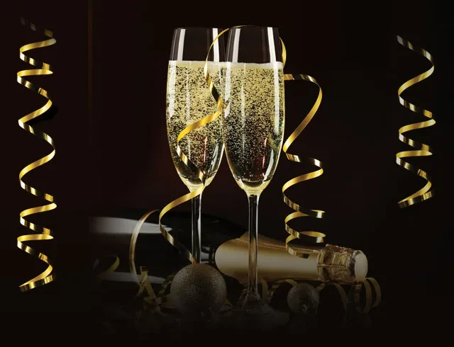 Two sparkling champagne flutes, gold ribbons, bottle silhouette on dark background.