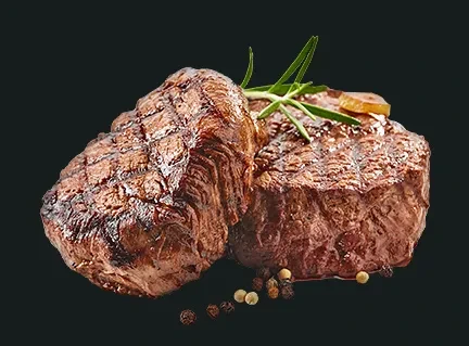 Two grilled steaks with prominent grill marks, rosemary, and peppercorns.