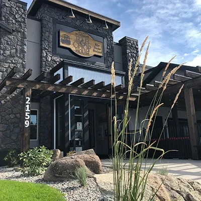 Montana's R&B Chop House exterior, modern rustic stone and wood design.