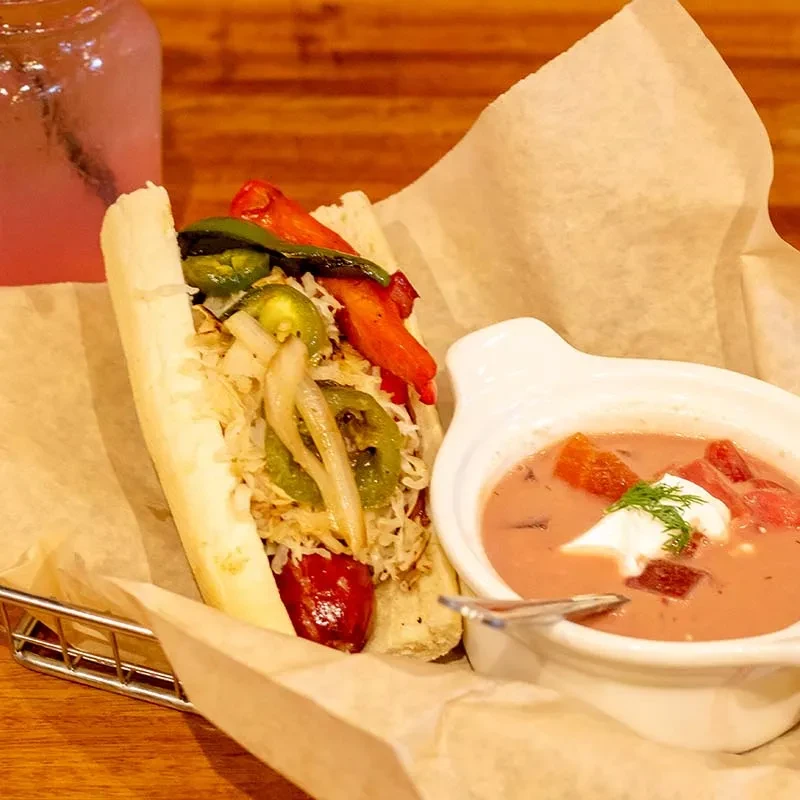 Hot dog with cabbage, peppers, onions; soup with sour cream and dill.