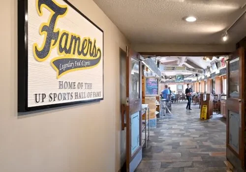 Restaurant entrance hallway with "Famers" sign and view of dining area.