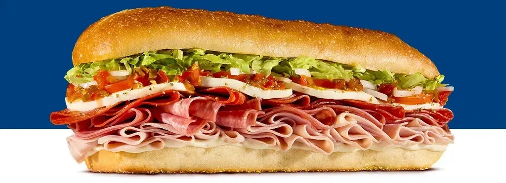 A large Italian-style sub sandwich with various meats and toppings.