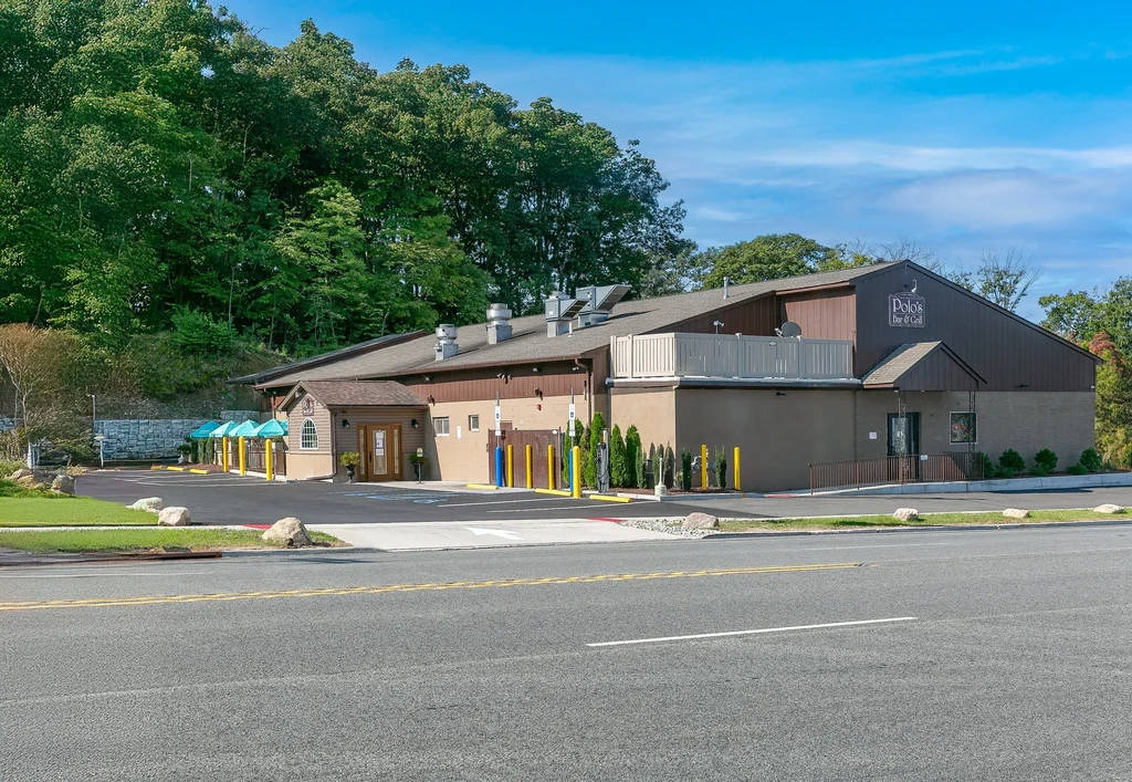 Polo's Bar & Grill, a multi-level building with patio and parking.
