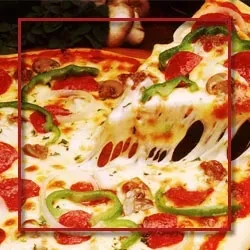 A slice of pizza with melted cheese, pepperoni, mushrooms, and green peppers.
